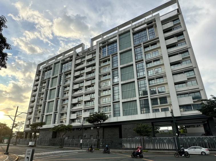 The Albany McKinley West residential tower facade seen from the street, Taguig