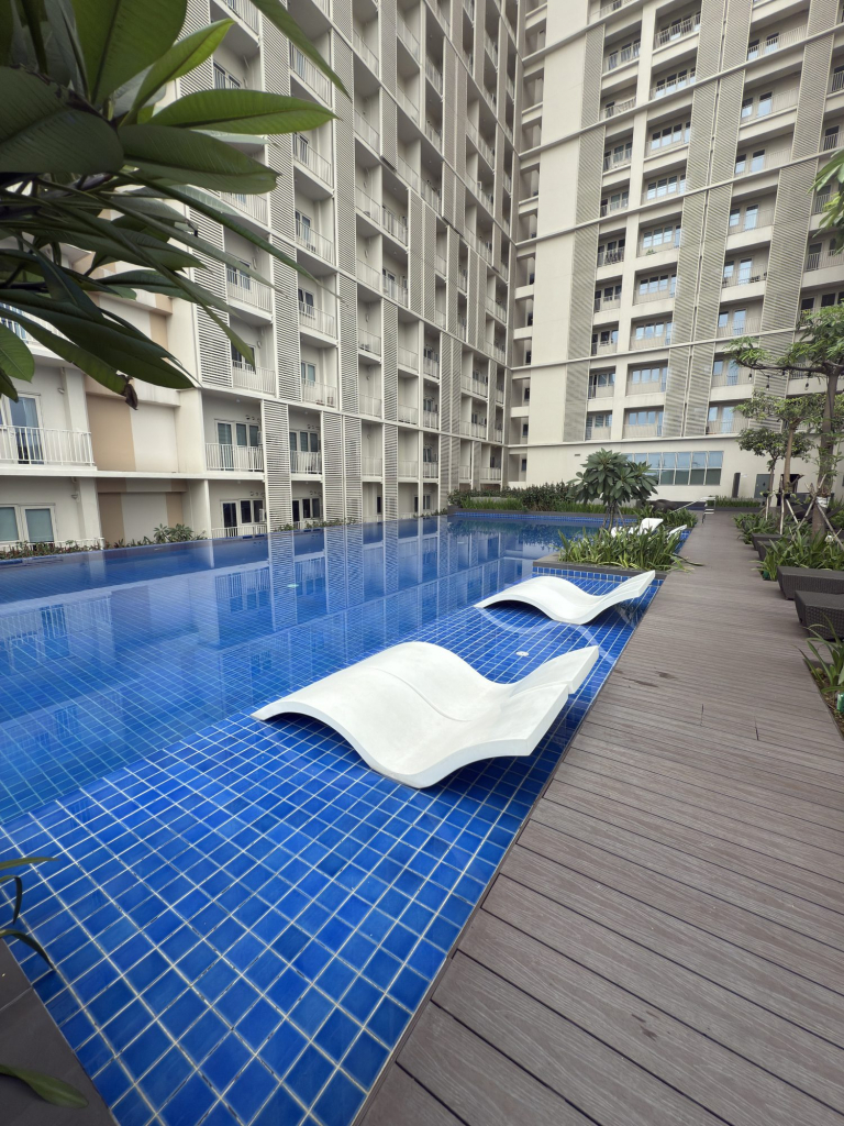 Park McKinley West wet lounge chairs in the pool